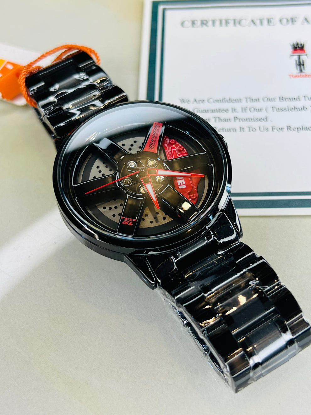 Skmei Wheel Watch – Spinner Wheel Design, Red Brake Cover, Black Titanium Case, 39mm Dial, PVD Vacuum Plated | 6-Month Machine Warranty